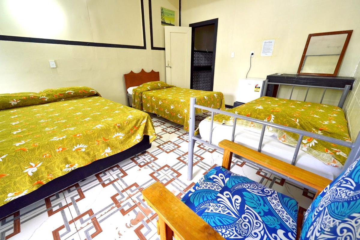 Quad Room offered by Vaisala Hotel